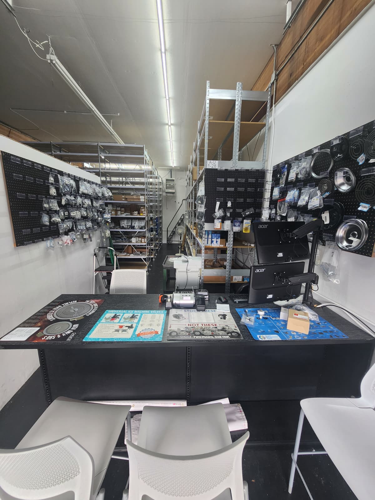 Inside Appliance Parts Trader retail store with parts counter and inventory